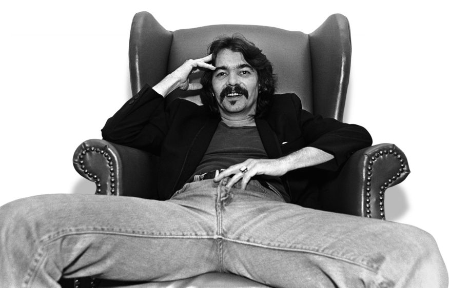 NASHVILLE, TN - 1981: Singer/songwriter John Prine poses in his hotel room during a 1981 Nashville, Tennessee, portrait photo session. Though he has written hit songs for other singers, Prine won his first Grammy in 1991 for the album "The Missing Years." (Photo by George Rose/Getty Images) *** Local Caption *** John Prine